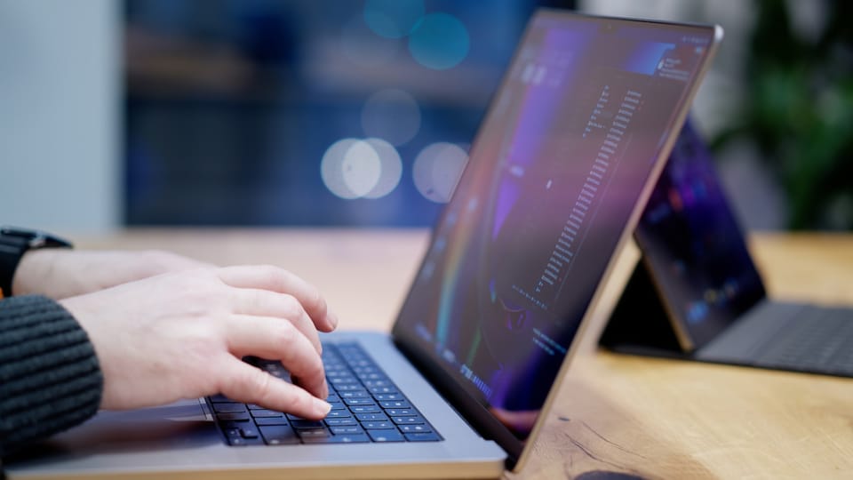 Person reviewing data on a laptop
